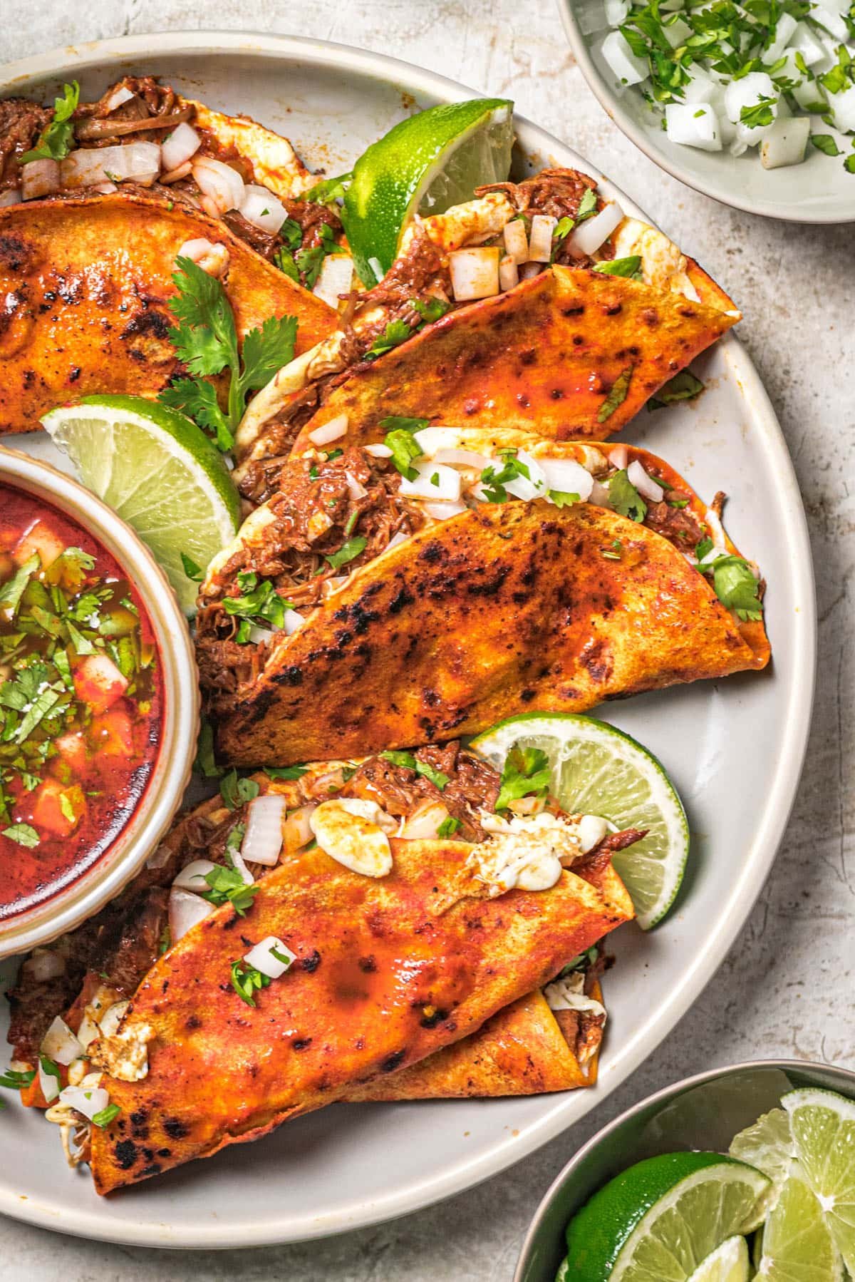 Delicious birria tacos with consome dipping sauce